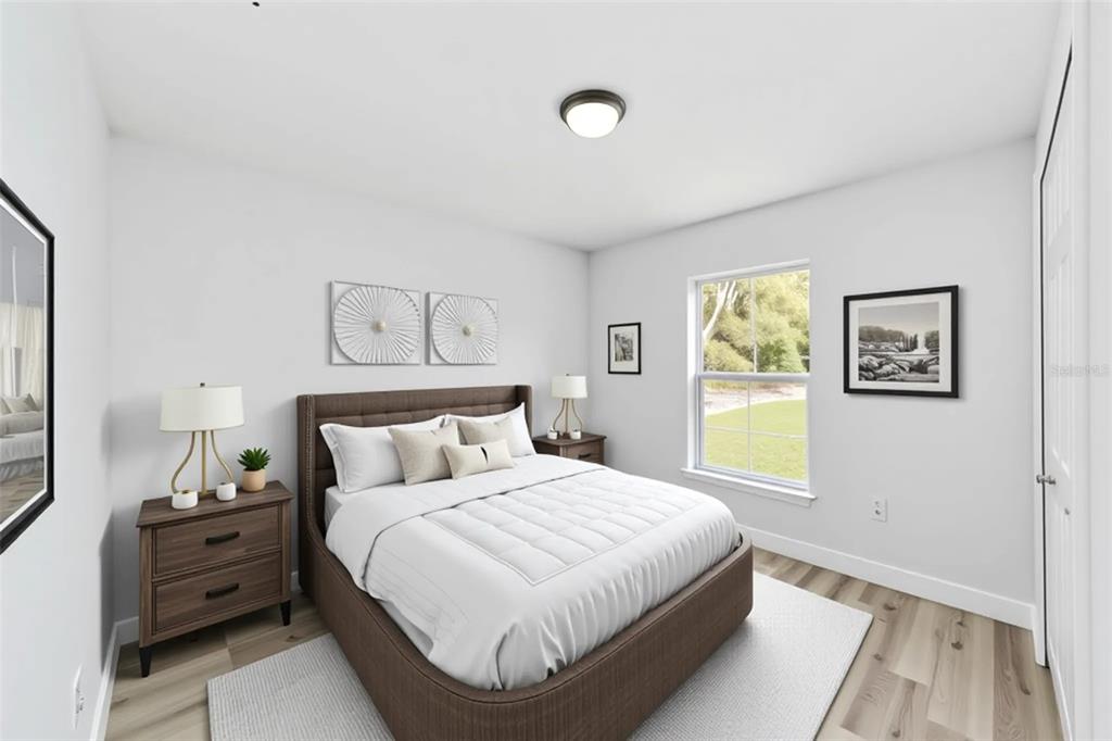 2871 Southwest 147th Terrace Ocala, FL 34481 - Photo 35 of 44 a bedroom with a bed and painting on the wall