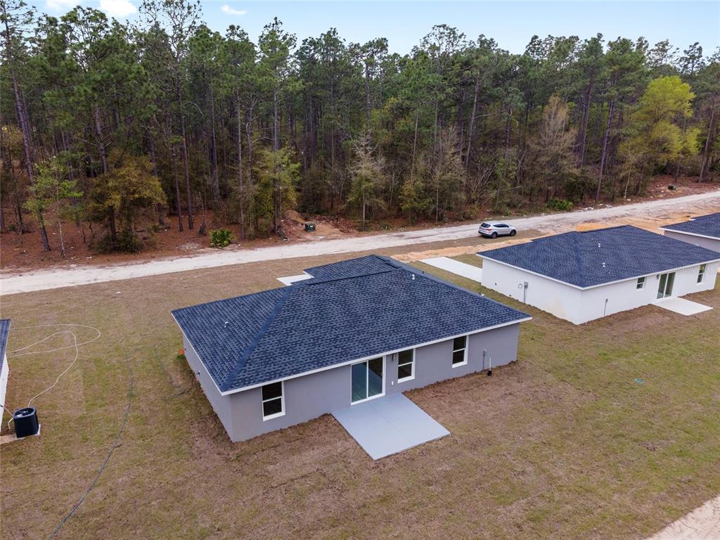 2871 Southwest 147th Terrace Ocala, FL 34481 - Photo 43 of 44 an aerial view of a house with a yard