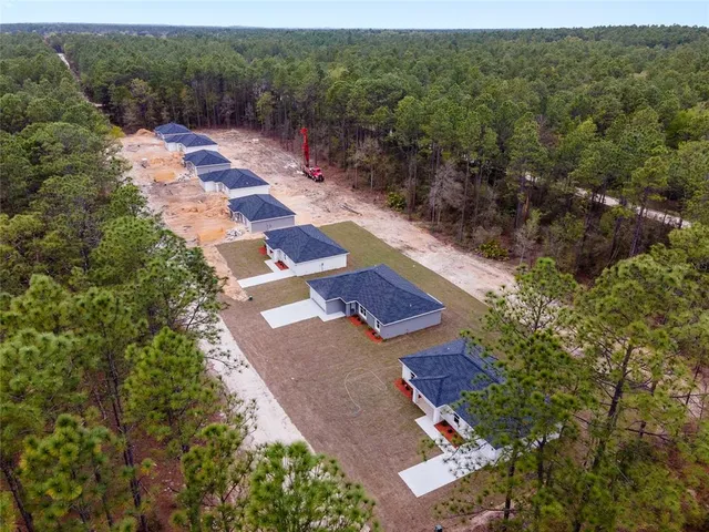 an aerial view of residential house with outdoor space