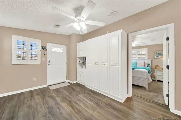 a view of livingroom with hardwood floor and a ceiling fan