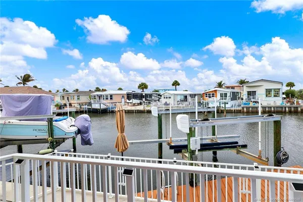 a balcony with lots of counter space and lake view