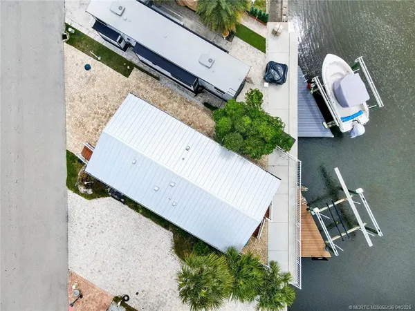 an aerial view of a house with stairs