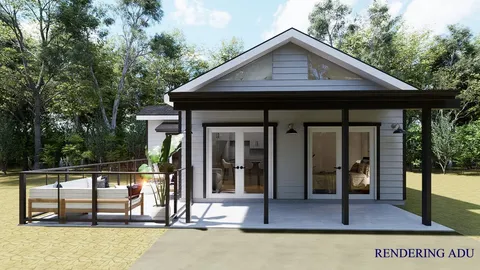 a view of a house with backyard and balcony