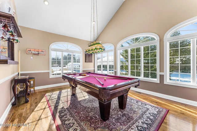 a living room with furniture and a bookshelf