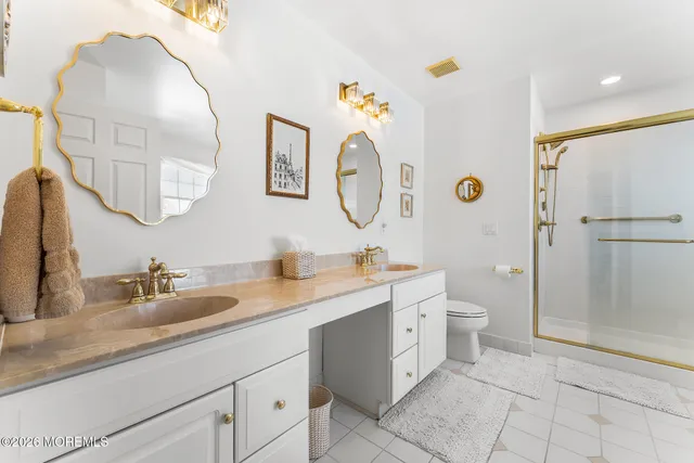 a bedroom with a bed couch and window