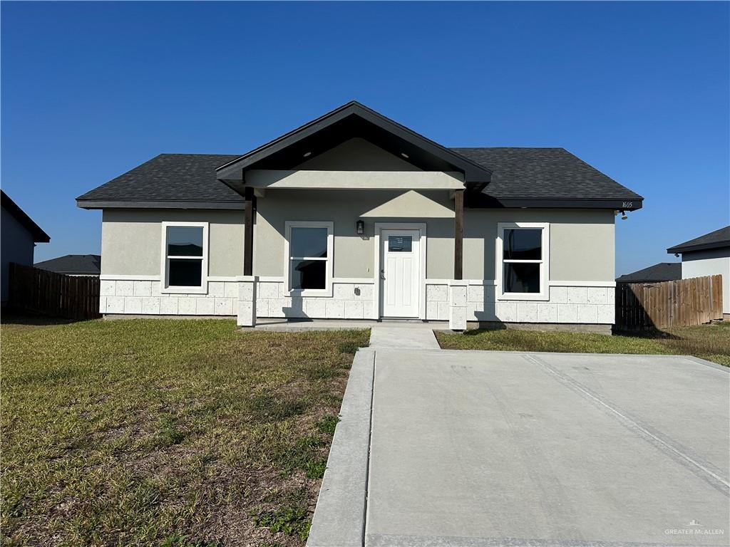 1605 Unity Drive Mercedes, TX 78570 - Photo 1 of 10 a front view of a house with garden
