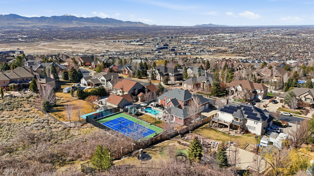 714 Draper Heights Way Draper, UT 84020 - Photo 84 of 88 Aerial view of residential area with a mountainous background and a pool area