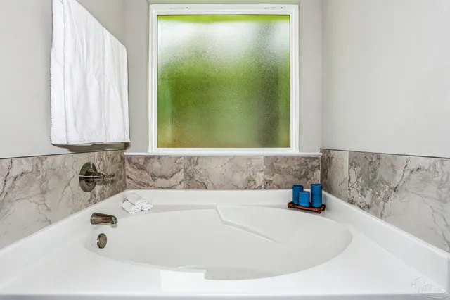 a bathroom with sink and bathtub