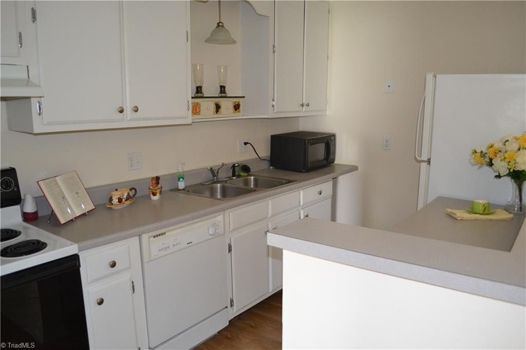 5735 Bramblegate Road Greensboro, NC 27409 - Photo 8 of 20 Stove, Dishwasher, Microwave & Fridge