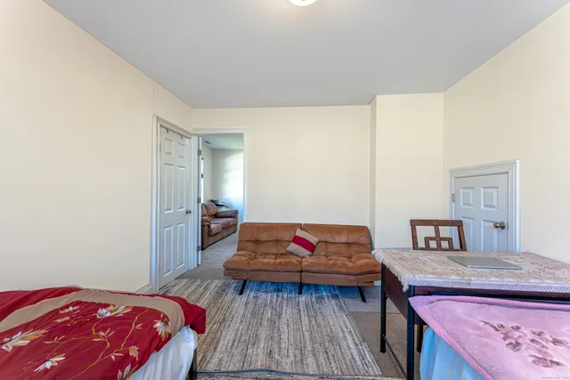 a bedroom with a bed and dresser