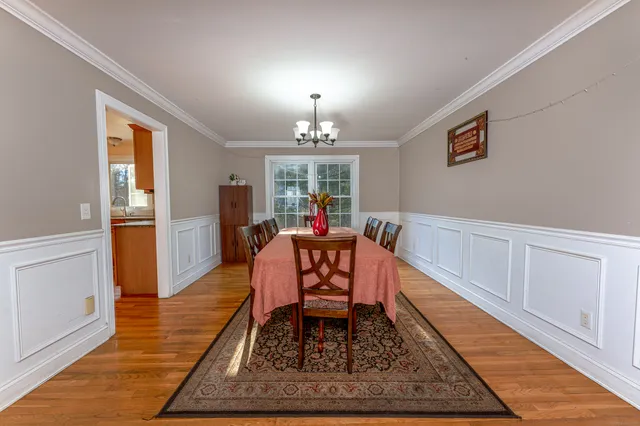 a living room with furniture rug and a window