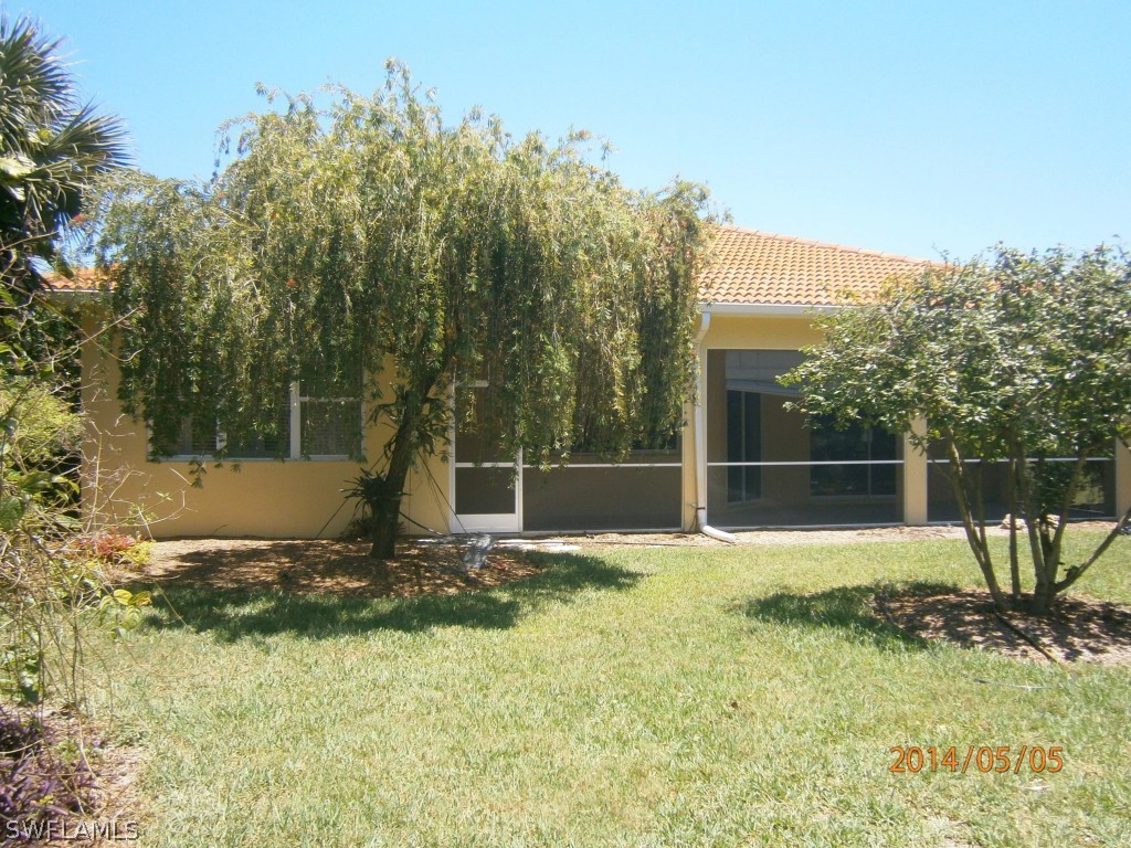 12854 Timber Ridge Drive Fort Myers, FL 33913 - Photo 23 of 23 a view of backyard with green space