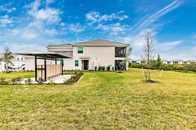a view of a golf course with an ocean