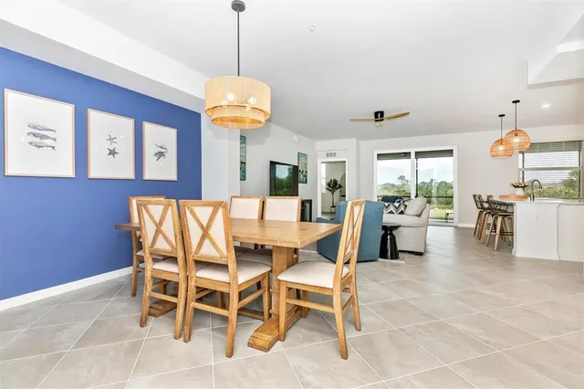 a view of a dining room with furniture wooden floor and chandelier
