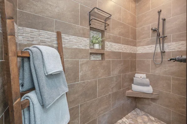 a bathroom with a granite countertop sink a toilet and a mirror