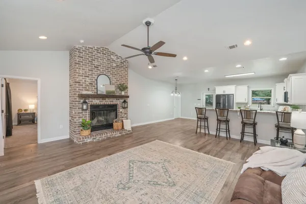 a living room with furniture and a fireplace