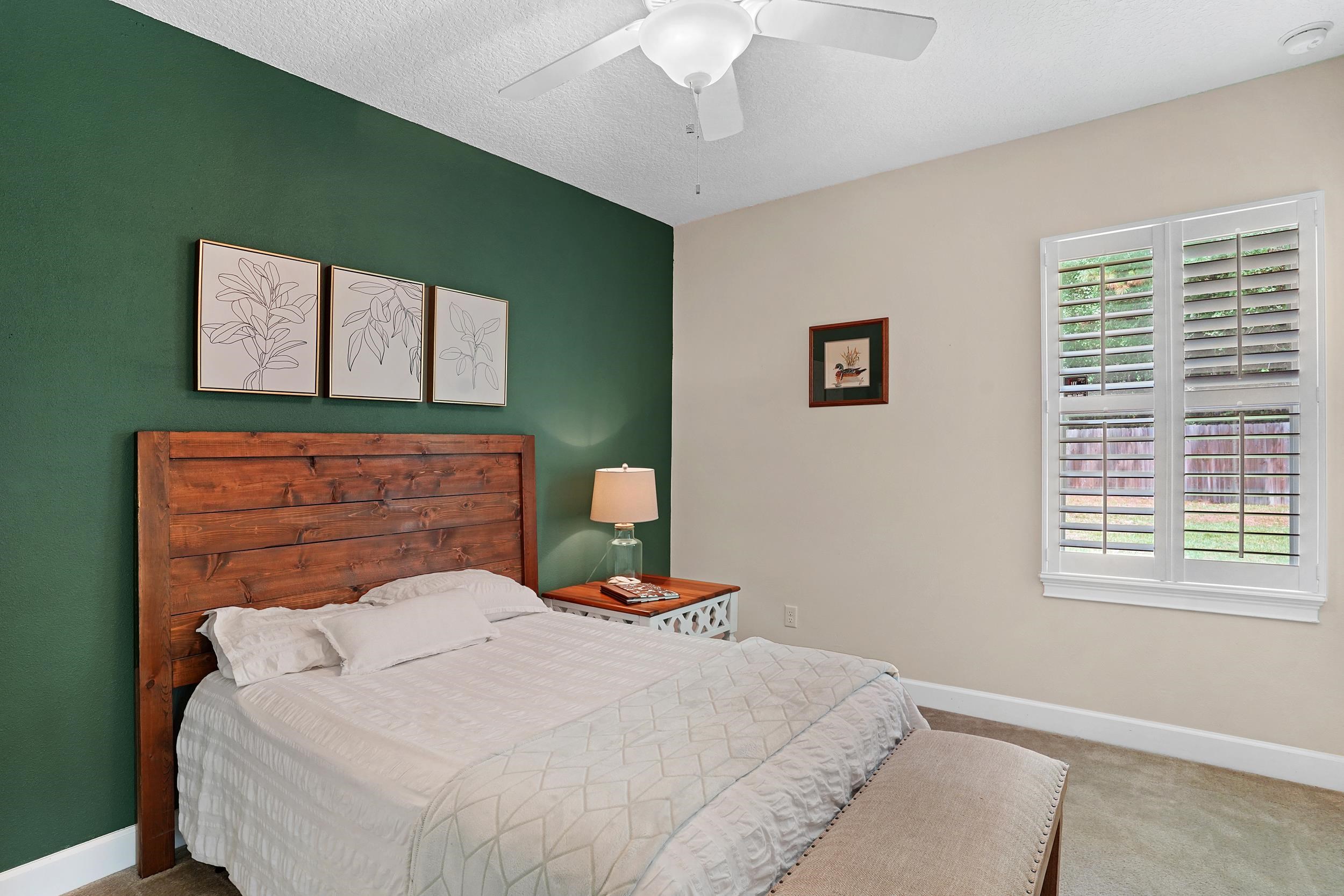 1308 Acorn Ridge Court St. Augustine, FL 32092 - Photo 26 of 47 a bedroom with a bed and a window