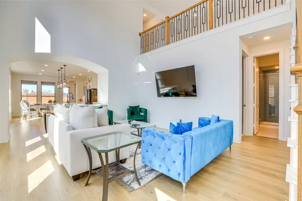 a living room with furniture cabinets and a flat screen tv