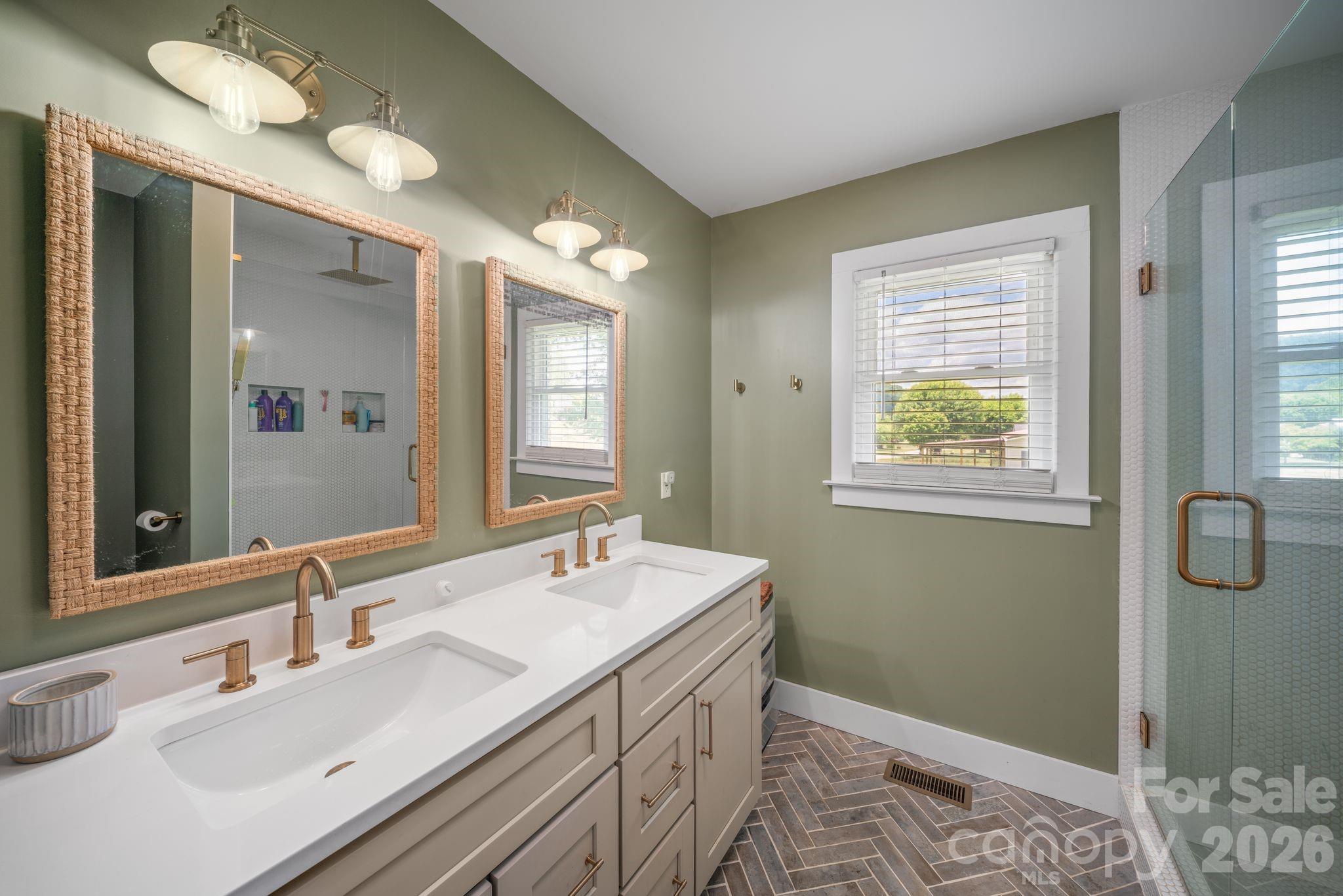 97 Paul Holland Road Canton, NC 28716 - Photo 27 of 35 a bathroom with 2 sink and a mirror