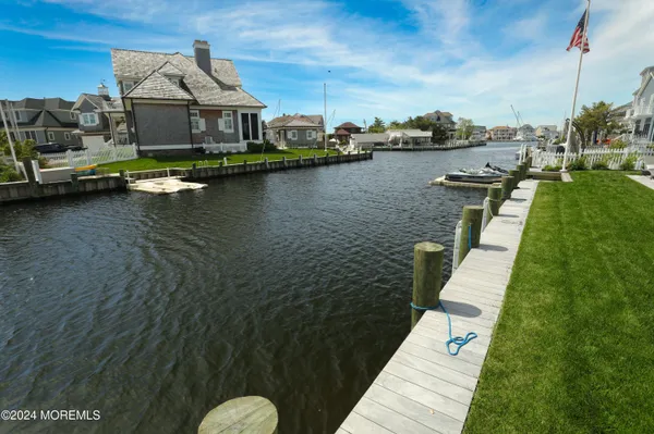 a living room filled with furniture and large pool table