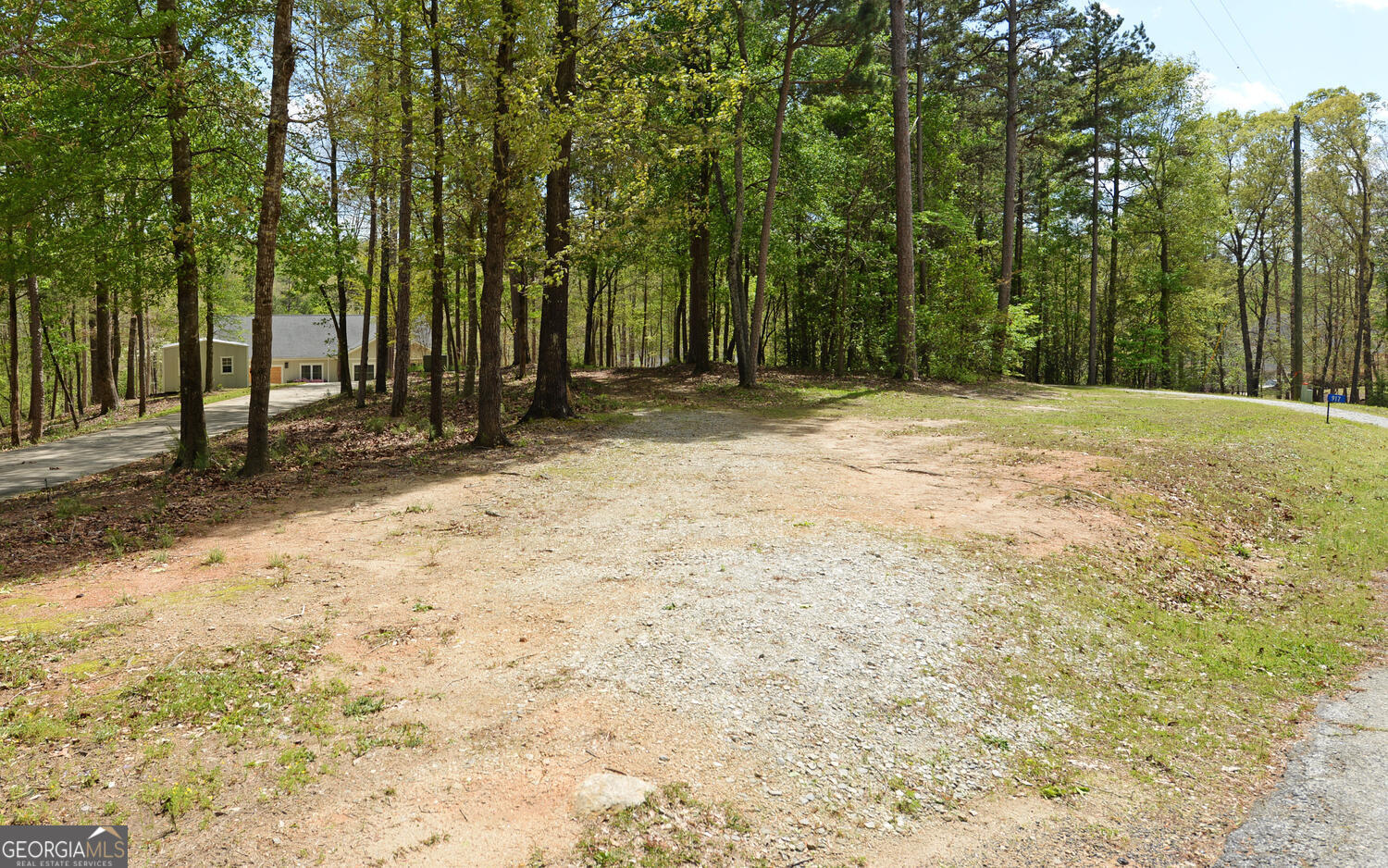 913 Paynes Creek Road, Unit LOT 11 Hartwell, GA 30643 - Photo 13 of 14 a backyard of a house with large trees