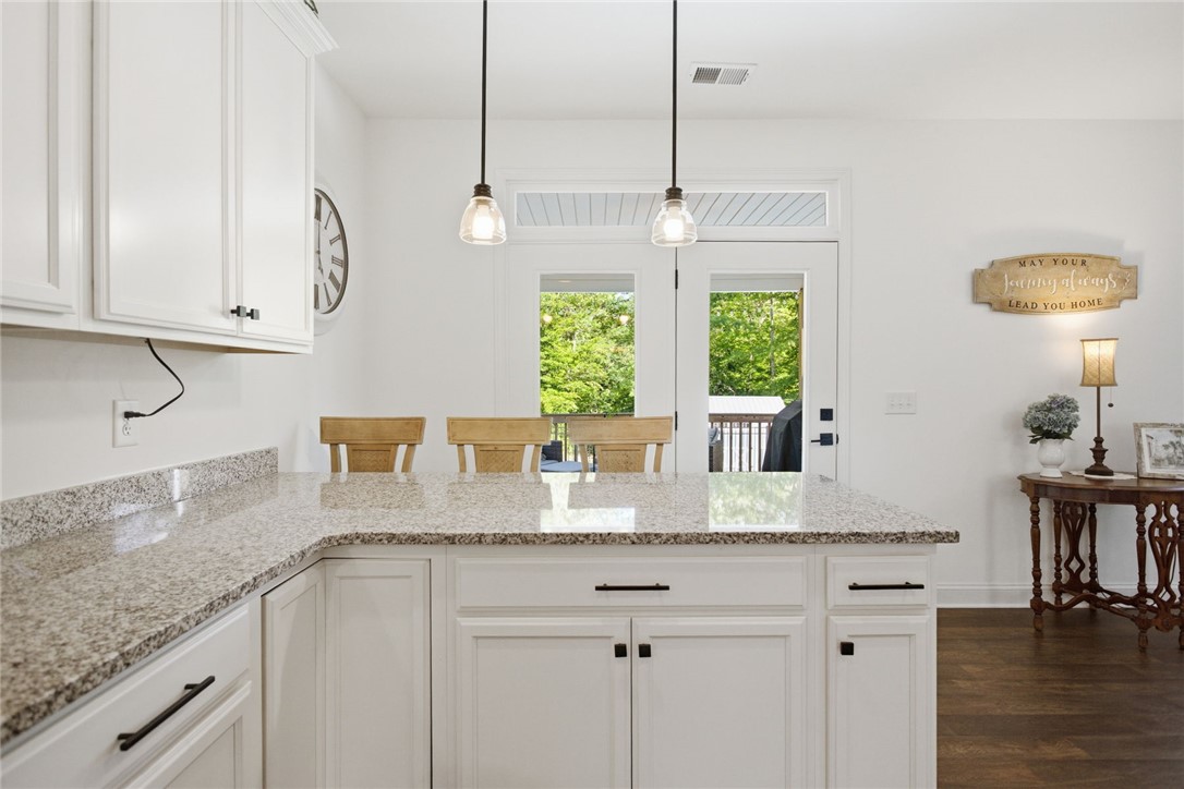 525 16th Circle Walhalla, SC 29691 - Photo 11 of 50 This bright kitchen features ample counter space and convenient outdoor access.