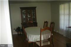 49239 Bennett Drive Ridge, MD 20680 - Photo 5 of 13 a balcony with table and chairs