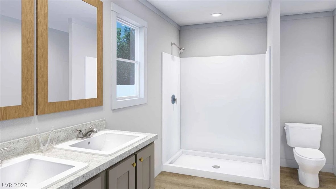 460 Box Canyon Road Alamo, NV 89001 - Photo 7 of 8 Double vanities and wood-look flooring establish a highly functional layout in this clean modern bathroom.