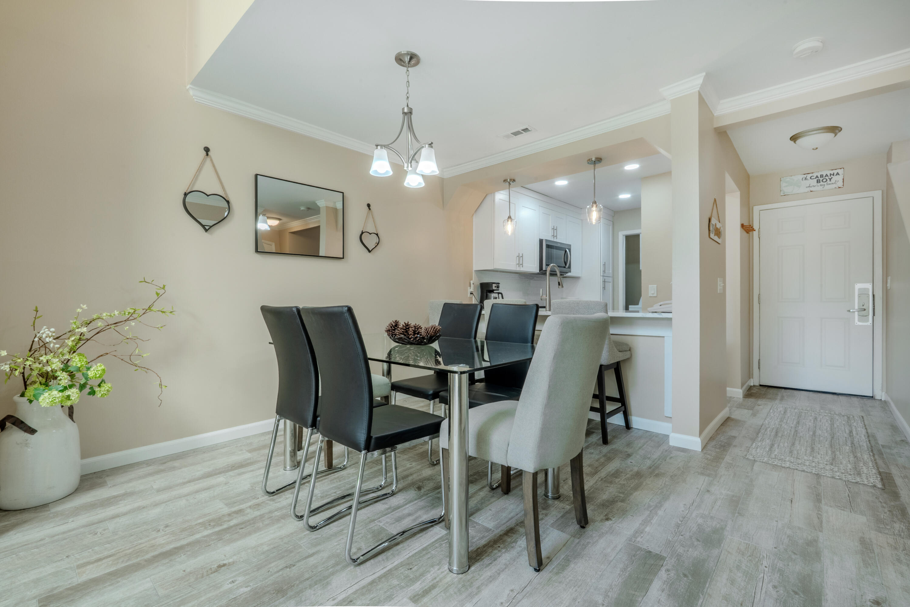 7 Wimbledon Court, Unit 7B Miramar Beach, FL 32550 - Photo 12 of 46 a view of a dining room with furniture and wooden floor
