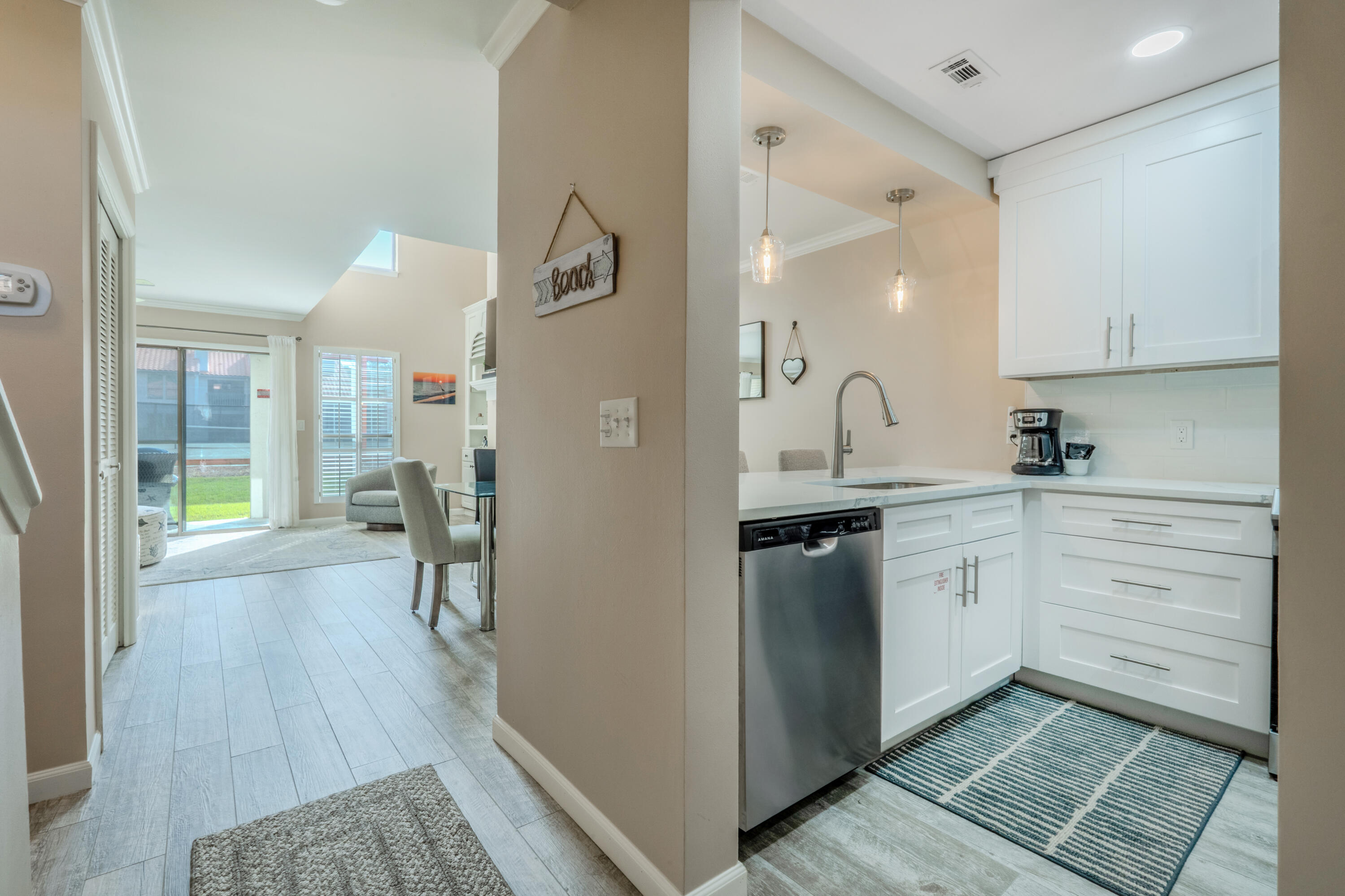 7 Wimbledon Court, Unit 7B Miramar Beach, FL 32550 - Photo 14 of 46 a kitchen with sink and cabinets
