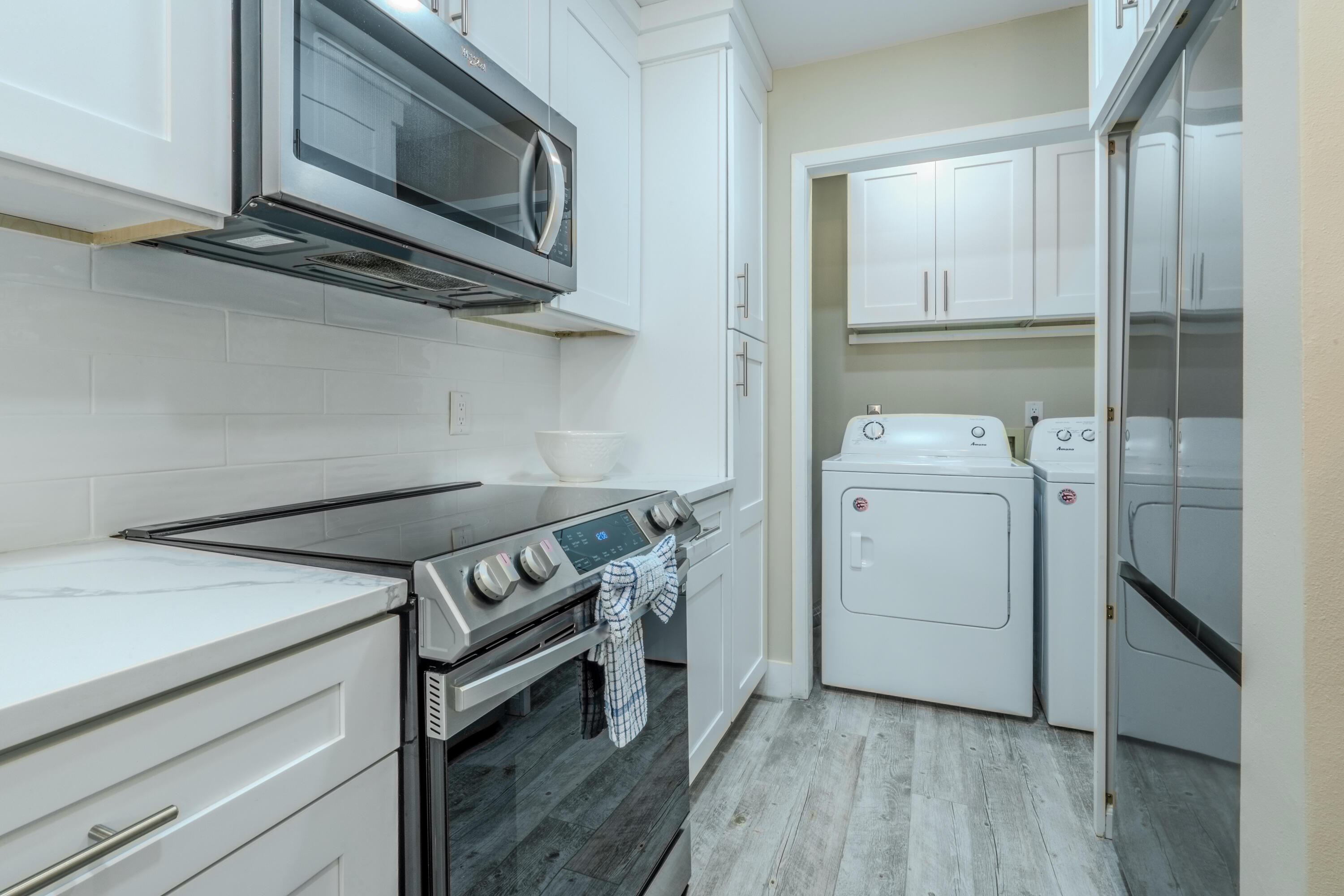 7 Wimbledon Court, Unit 7B Miramar Beach, FL 32550 - Photo 18 of 46 a utility room with dryer and washer