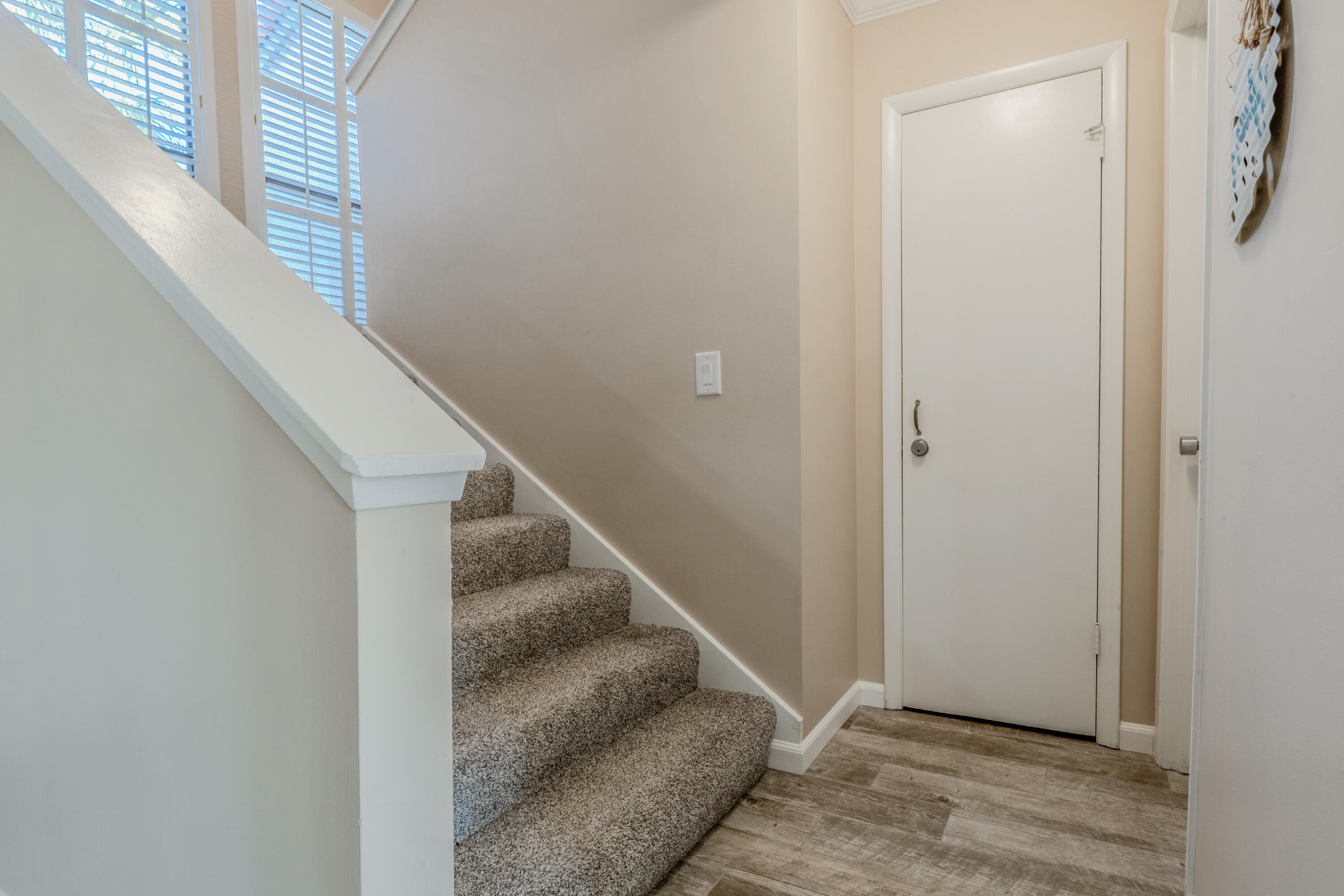 7 Wimbledon Court, Unit 7B Miramar Beach, FL 32550 - Photo 20 of 46 a view of entryway and hall with wooden floor