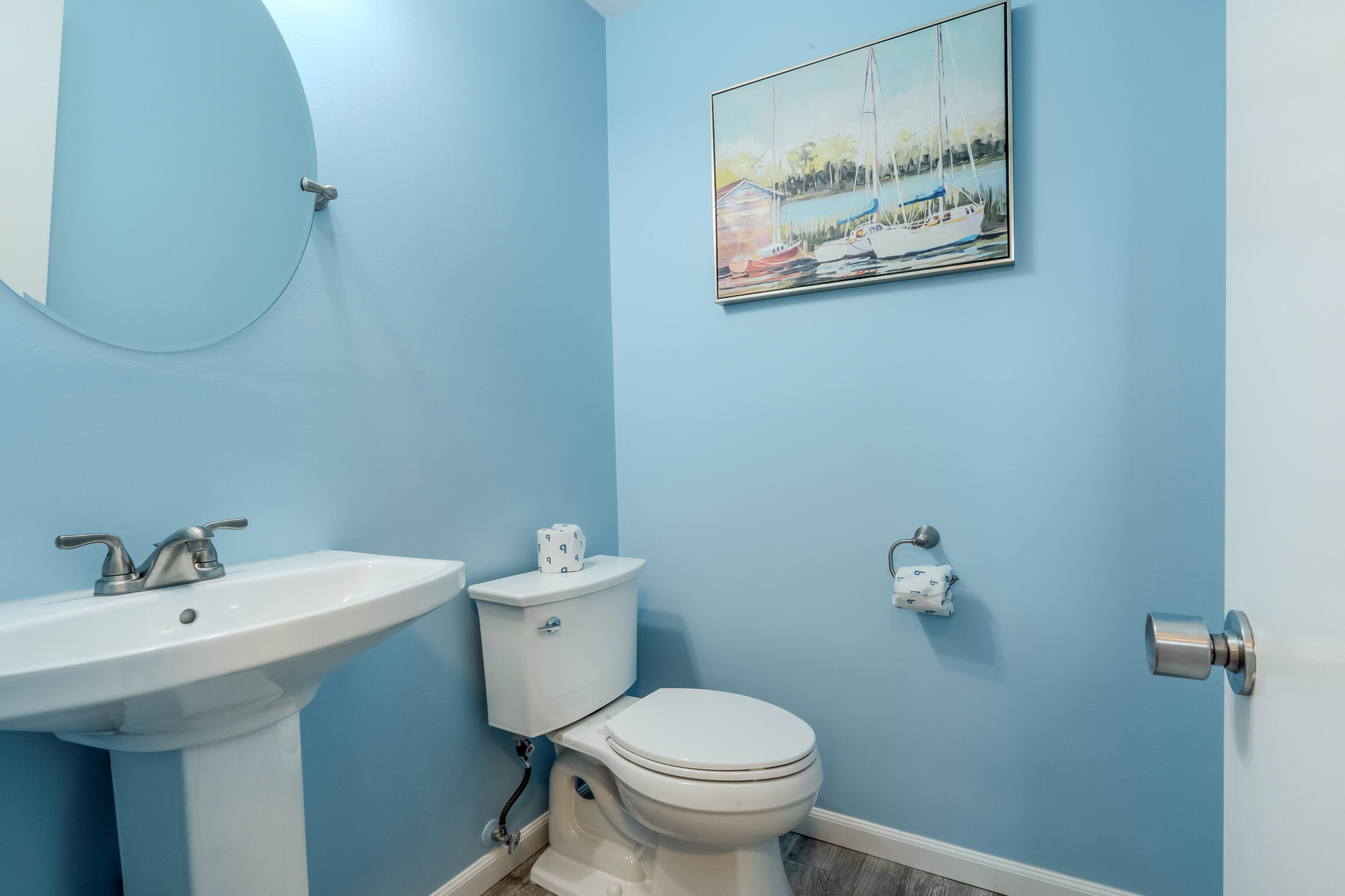 7 Wimbledon Court, Unit 7B Miramar Beach, FL 32550 - Photo 22 of 46 a bathroom with a toilet a sink and mirror