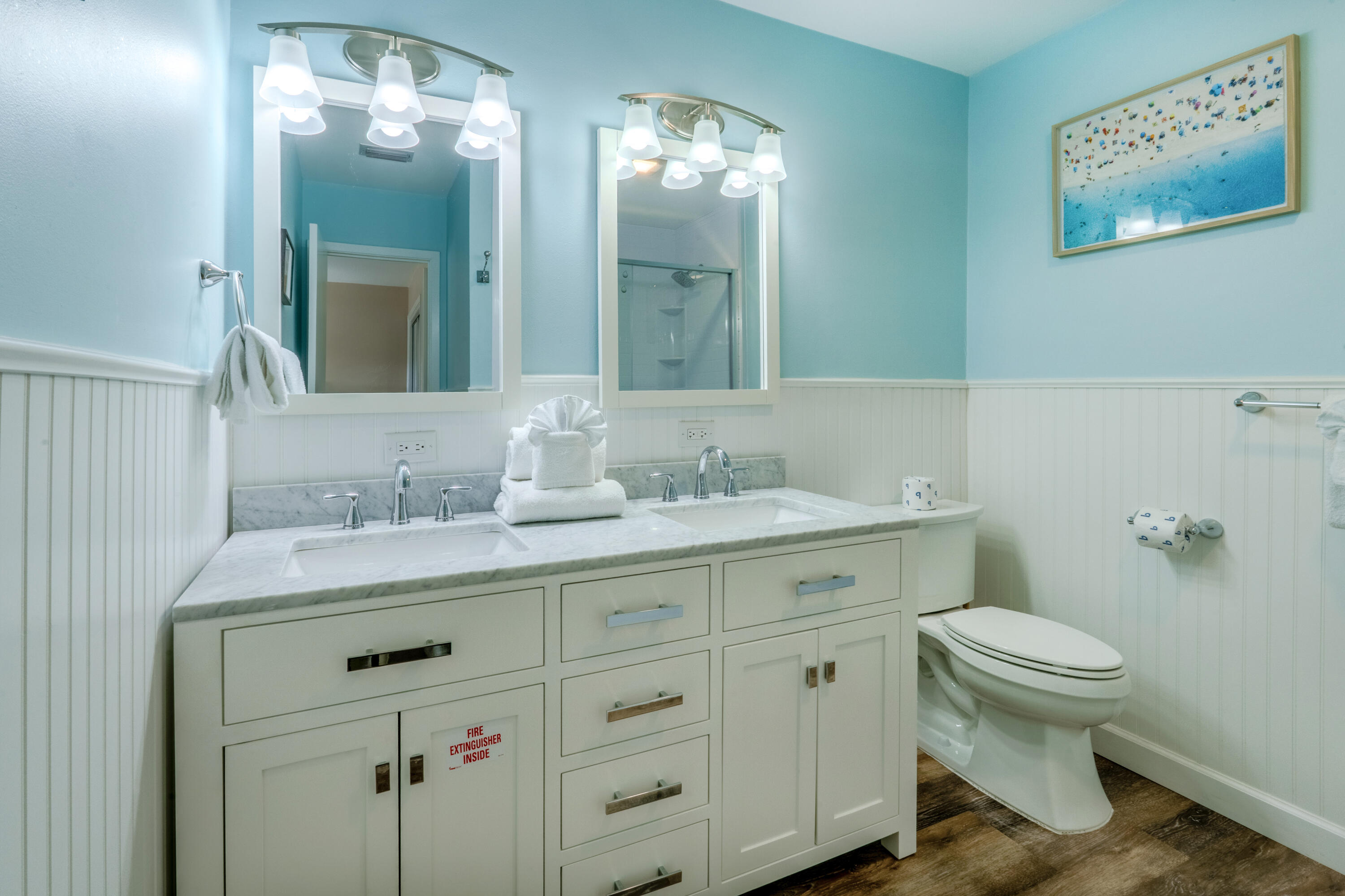 7 Wimbledon Court, Unit 7B Miramar Beach, FL 32550 - Photo 28 of 46 a bathroom with a toilet a sink and mirror