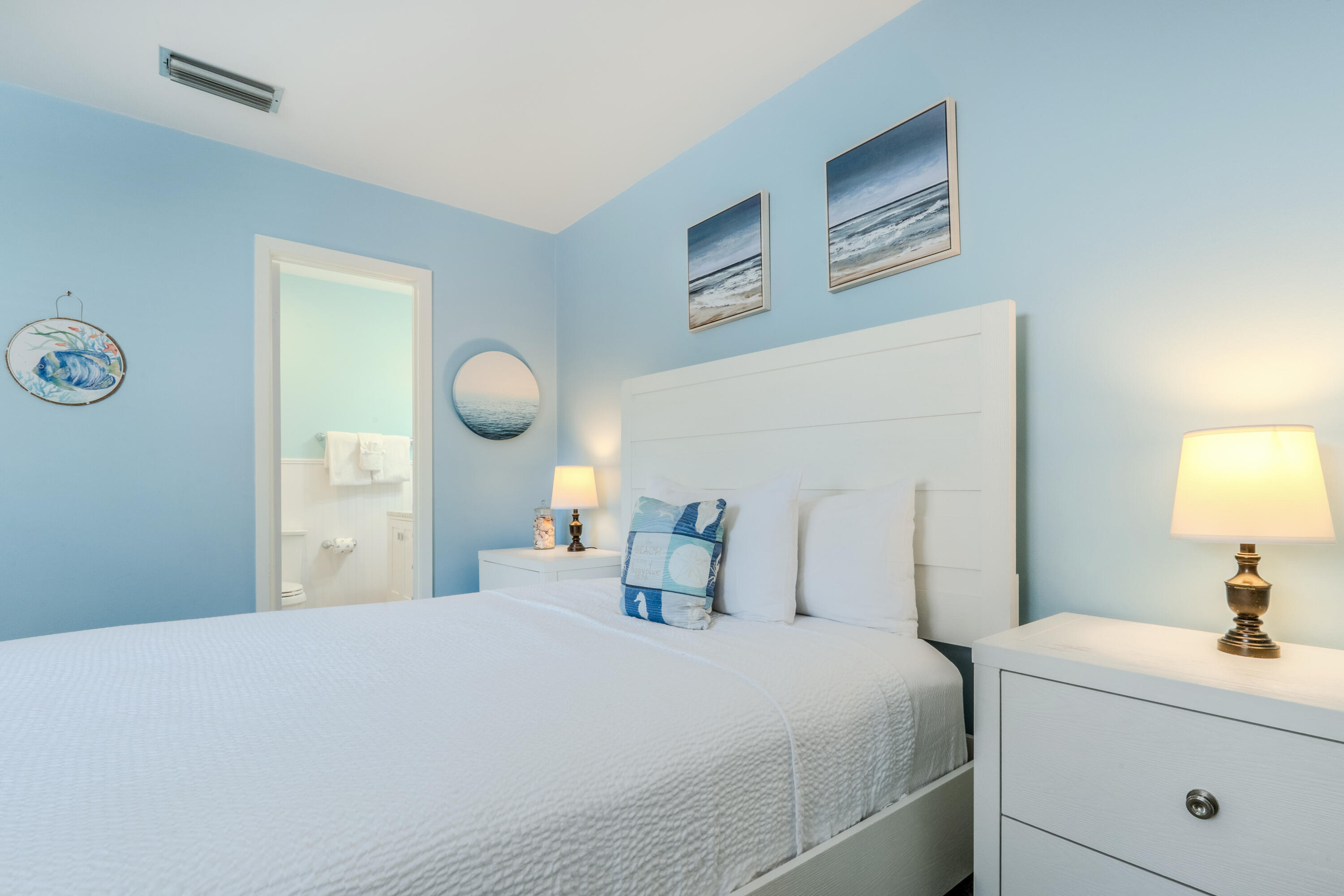 7 Wimbledon Court, Unit 7B Miramar Beach, FL 32550 - Photo 31 of 46 a bedroom with a bed and a lamp