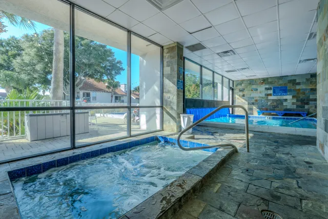 a view of house with outdoor space and parking