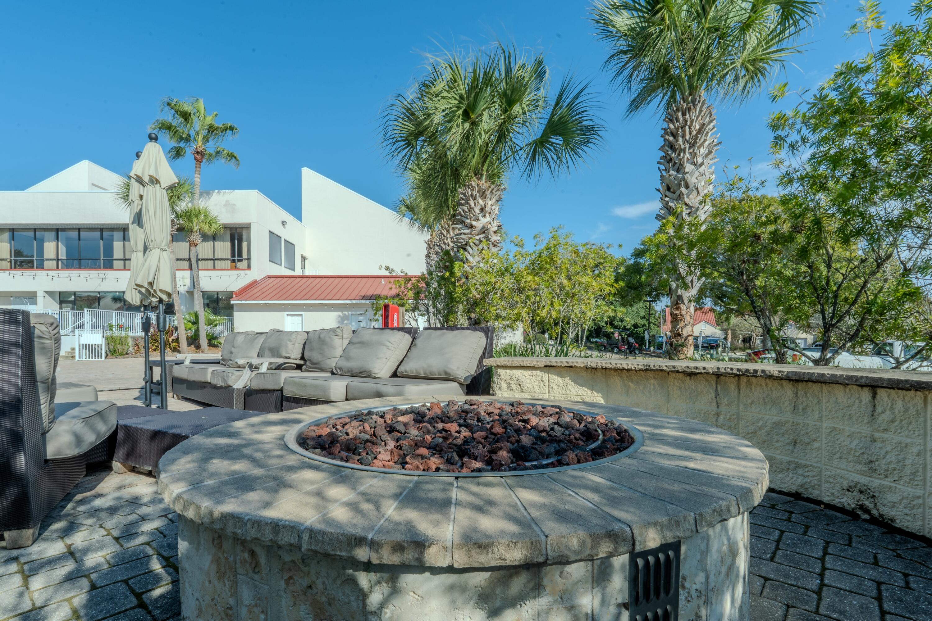 7 Wimbledon Court, Unit 7B Miramar Beach, FL 32550 - Photo 43 of 46 a view of a house with pool and sitting area