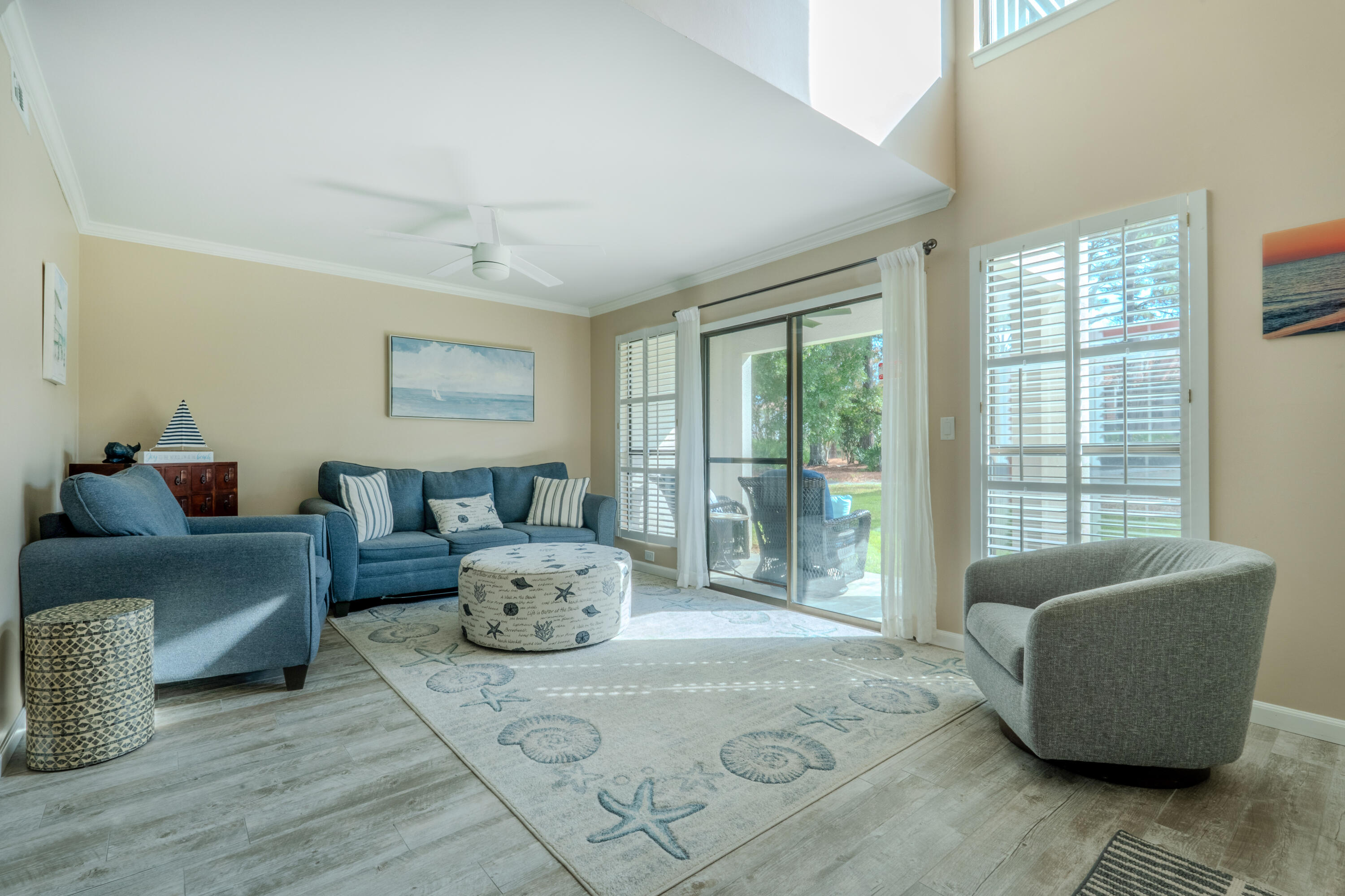 7 Wimbledon Court, Unit 7B Miramar Beach, FL 32550 - Photo 6 of 46 a living room with furniture and a large window