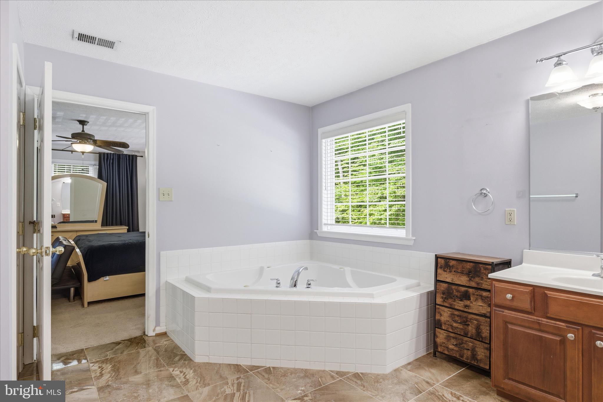 5829 Lockmere Place Waldorf, MD 20601 - Photo 27 of 54 a bathroom with a tub sink and mirror