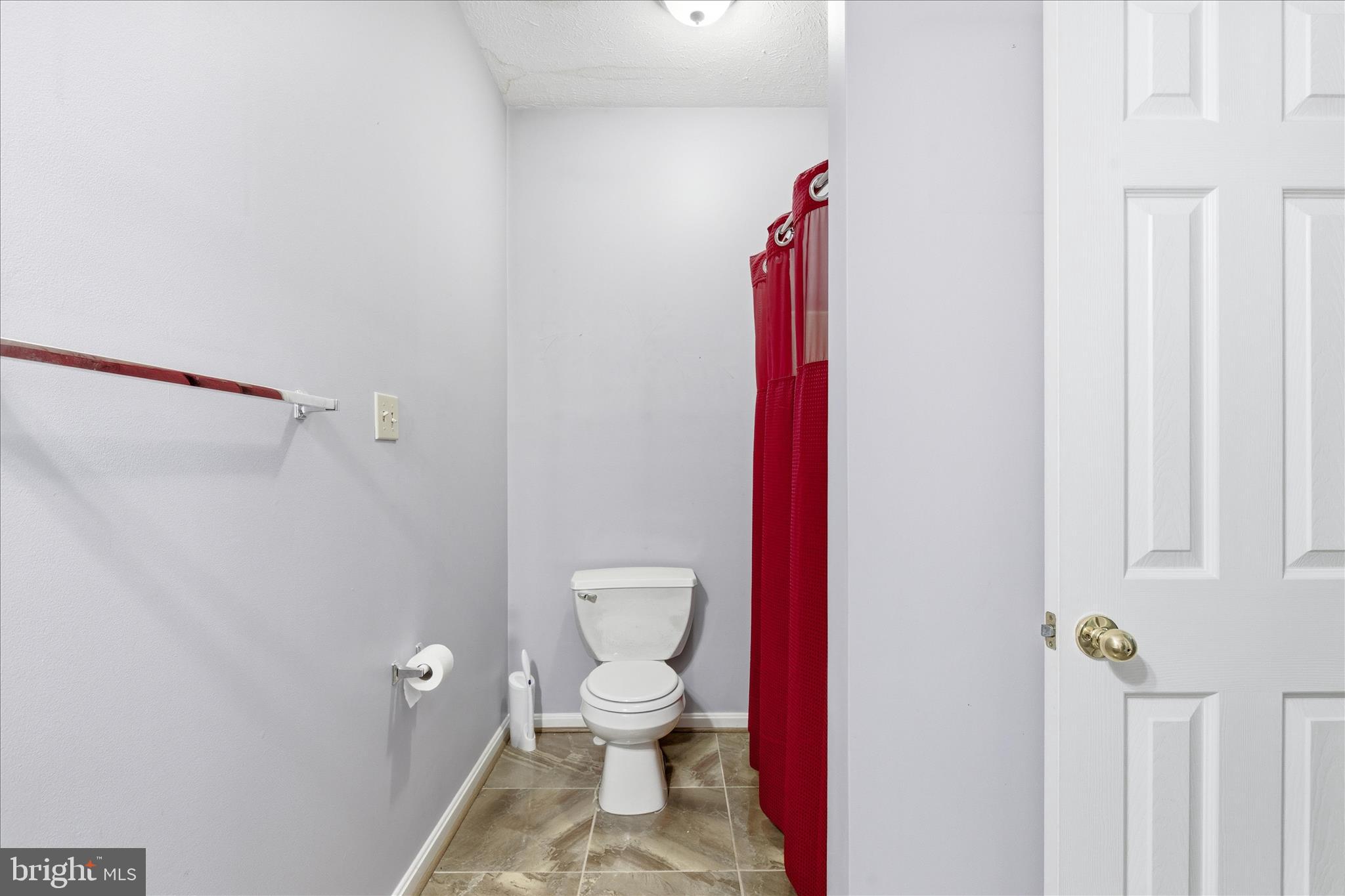 5829 Lockmere Place Waldorf, MD 20601 - Photo 30 of 54 a bathroom with a toilet and a shower curtain