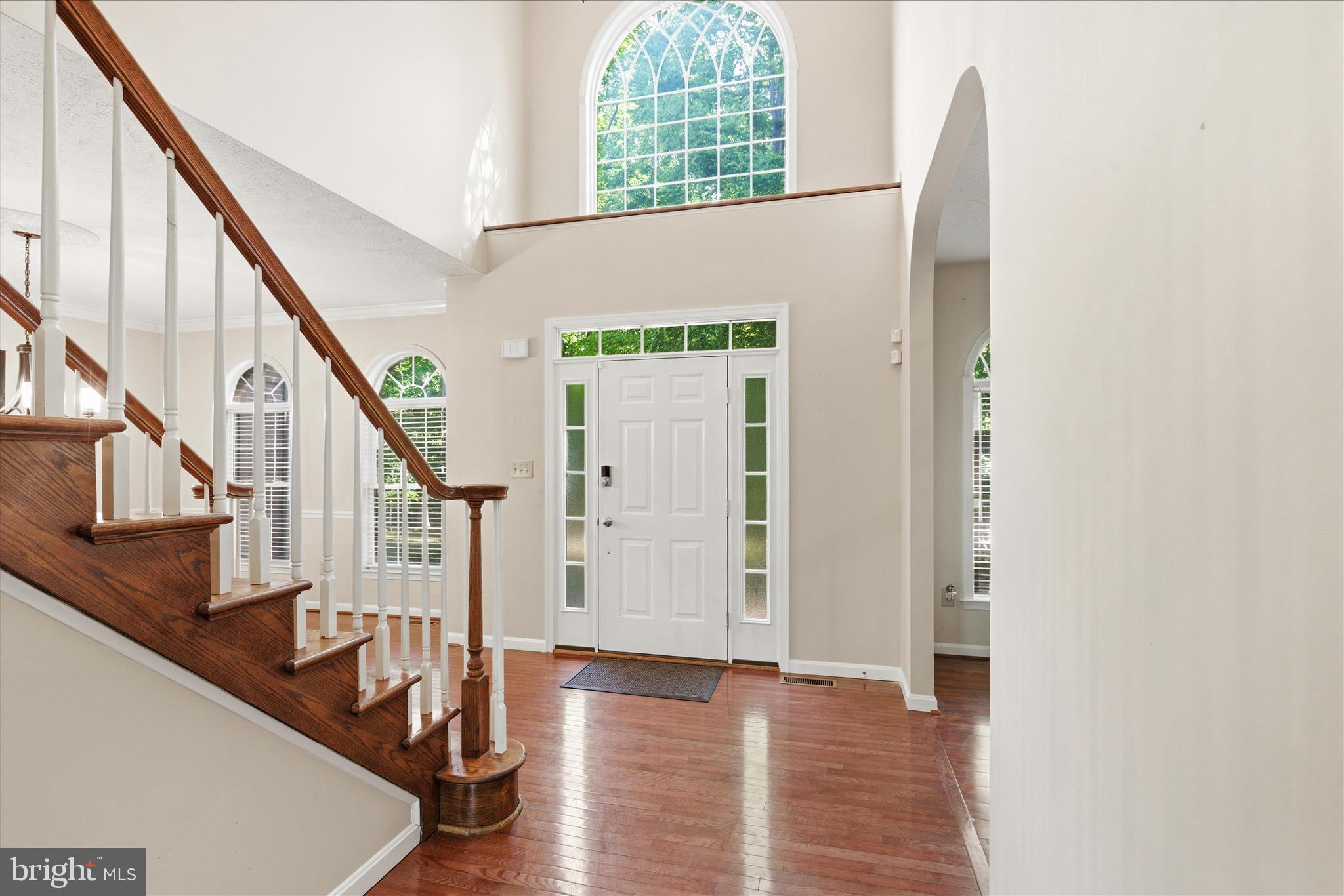 5829 Lockmere Place Waldorf, MD 20601 - Photo 3 of 54 a view of entryway with wooden floor and stairs