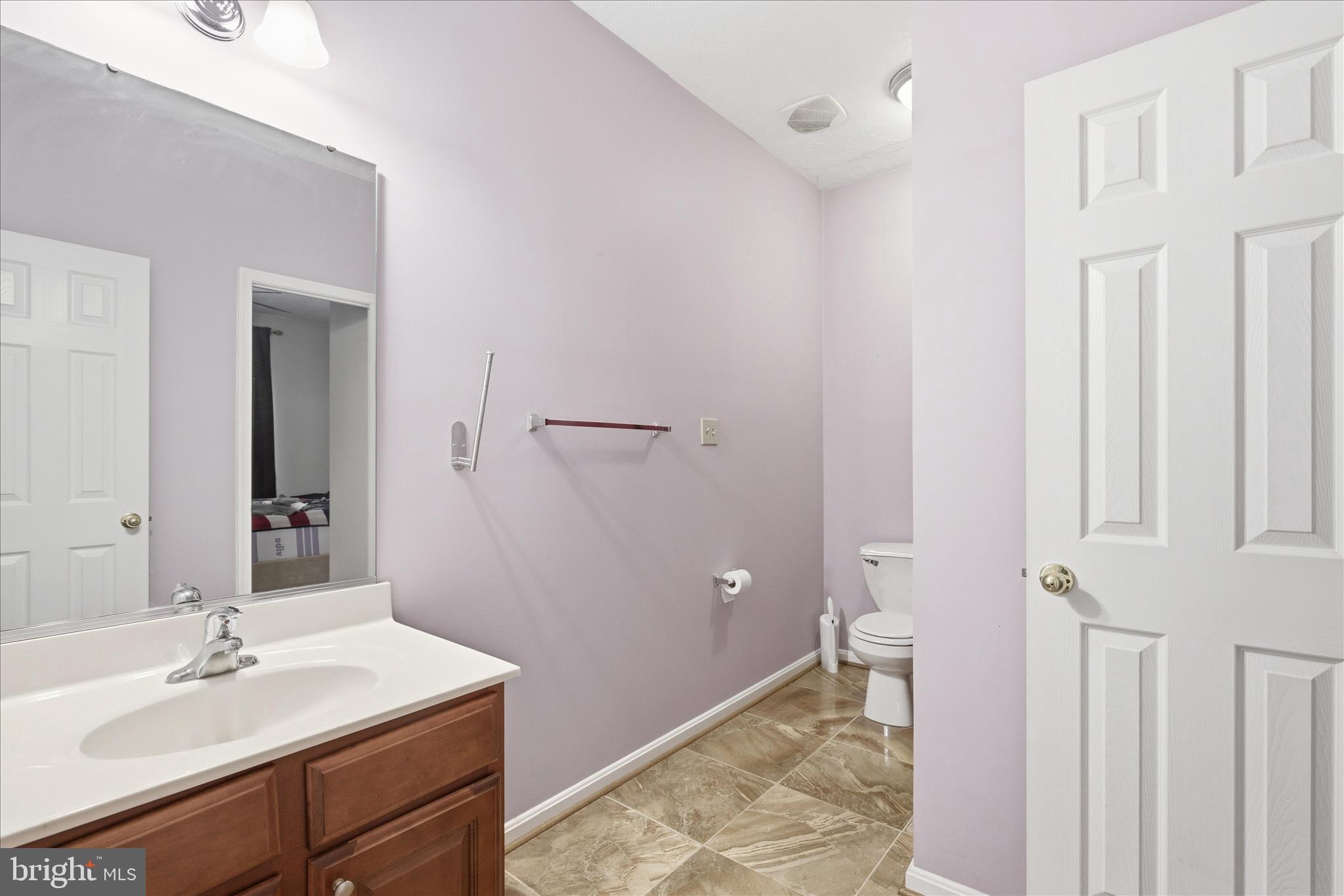 5829 Lockmere Place Waldorf, MD 20601 - Photo 31 of 54 a bathroom with a sink and a mirror