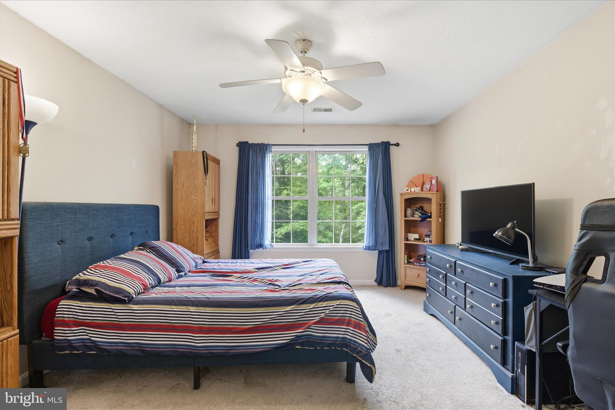 5829 Lockmere Place Waldorf, MD 20601 - Photo 35 of 54 a bedroom with a bed and a flat screen tv