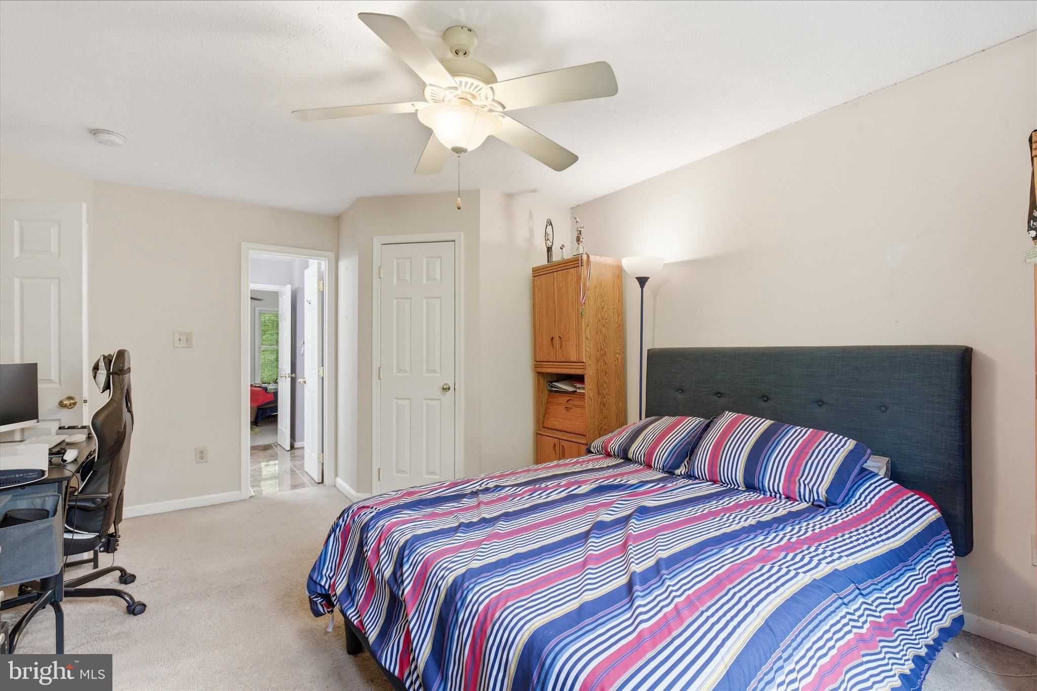 5829 Lockmere Place Waldorf, MD 20601 - Photo 36 of 54 a bedroom with a bed and a chandelier