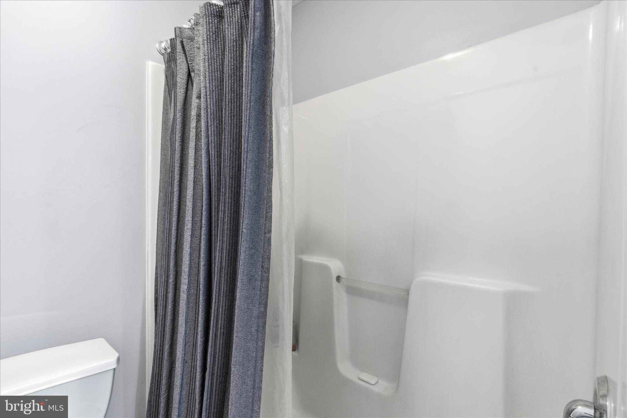 5829 Lockmere Place Waldorf, MD 20601 - Photo 42 of 54 a bathroom with a shower curtain