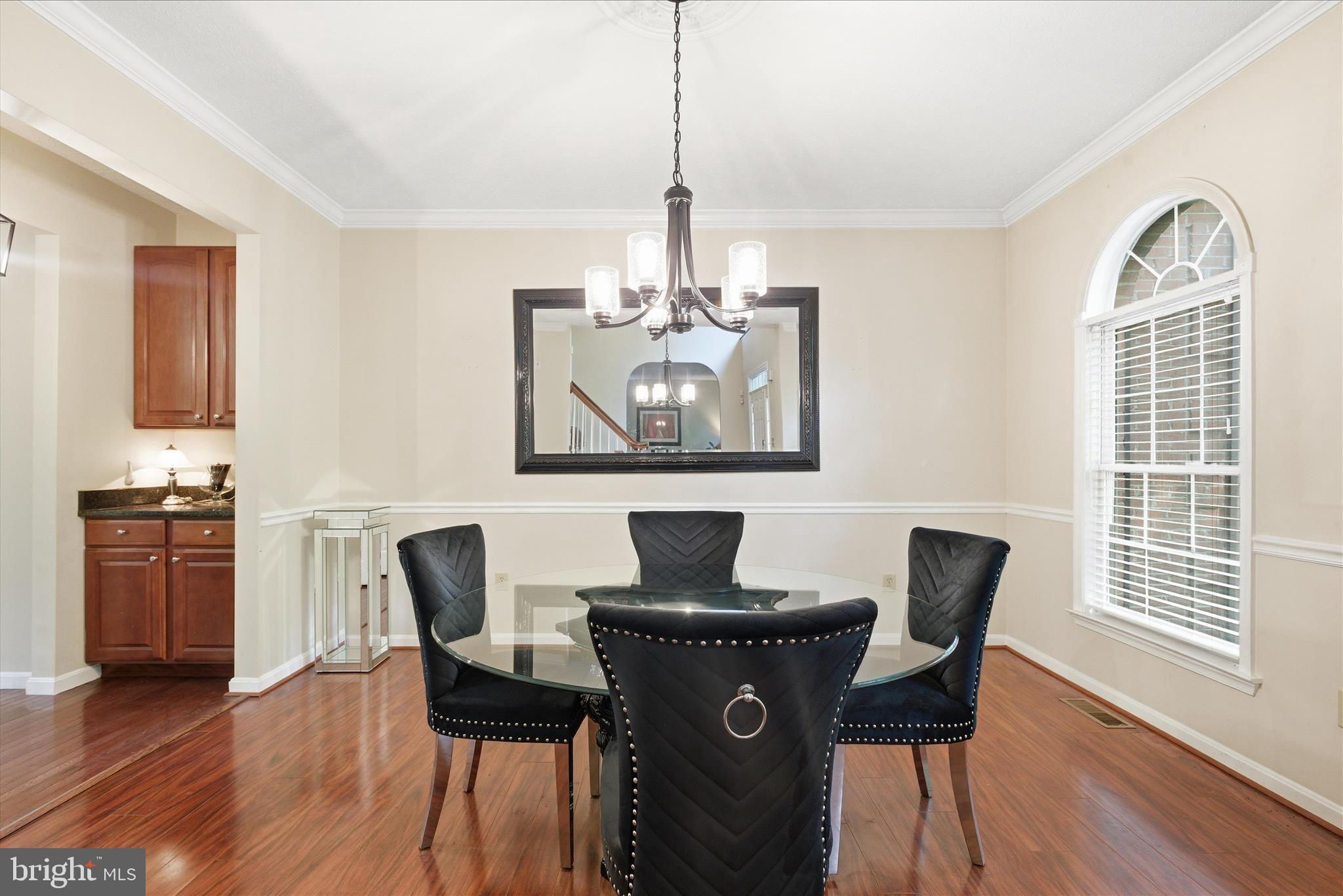 5829 Lockmere Place Waldorf, MD 20601 - Photo 5 of 54 a view of a dining room with furniture window and wooden floor