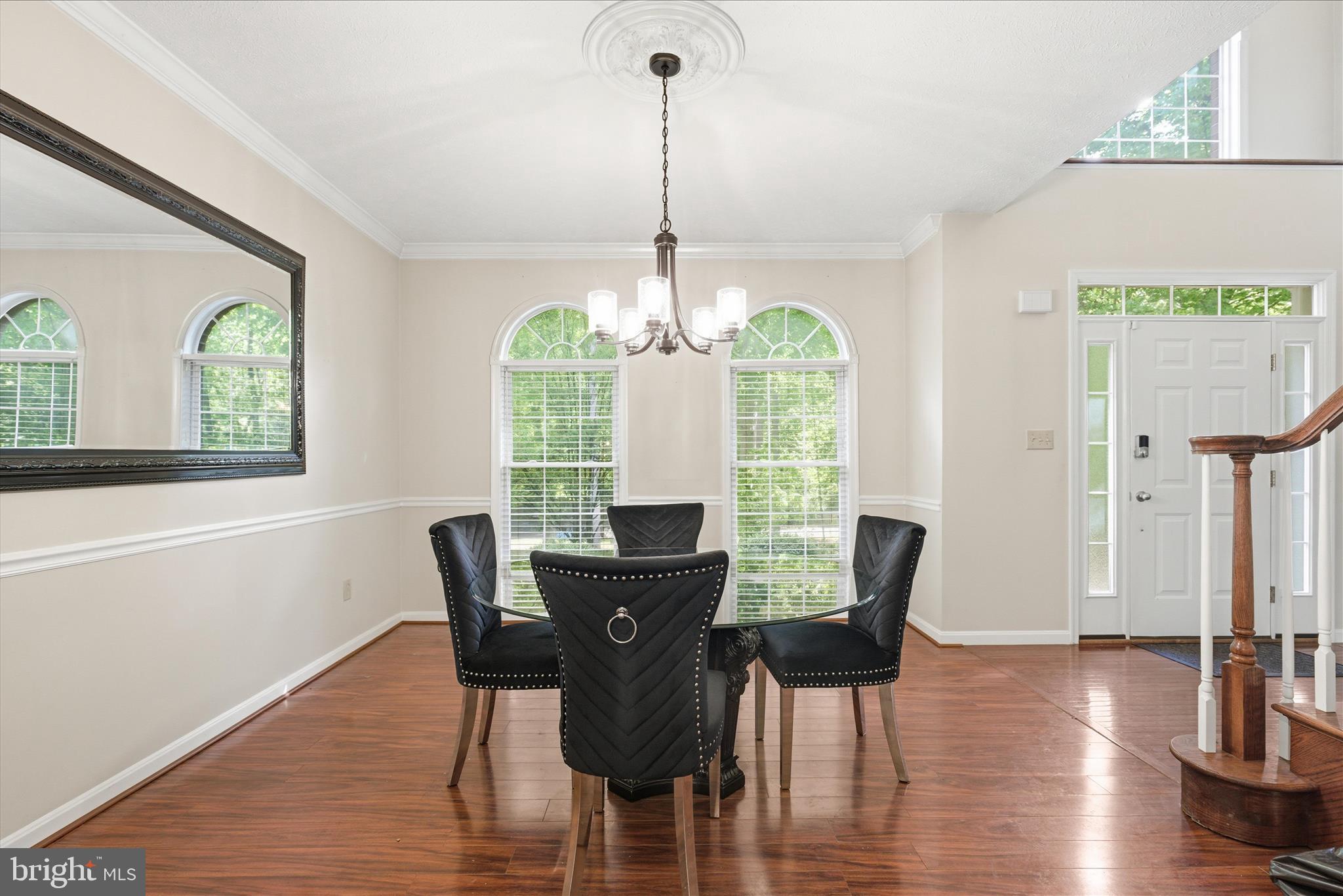 5829 Lockmere Place Waldorf, MD 20601 - Photo 6 of 54 a view of a dining room with furniture window and wooden floor