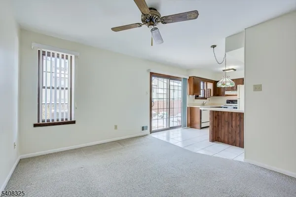 a view of kitchen with furniture and stainless steel appliances