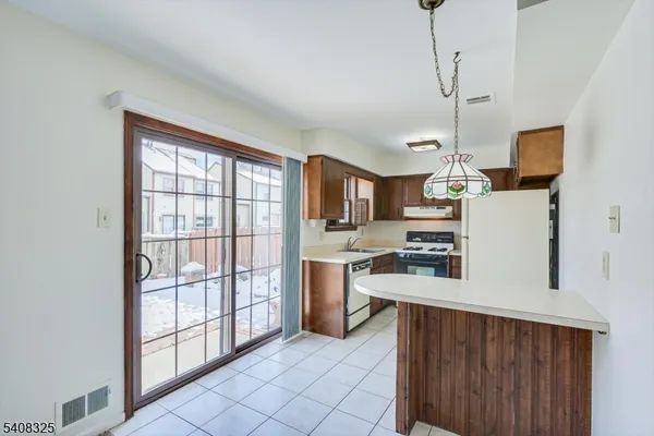 a kitchen with a stove and a sink