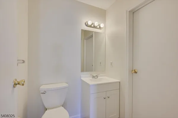 an empty room with a windows and closet